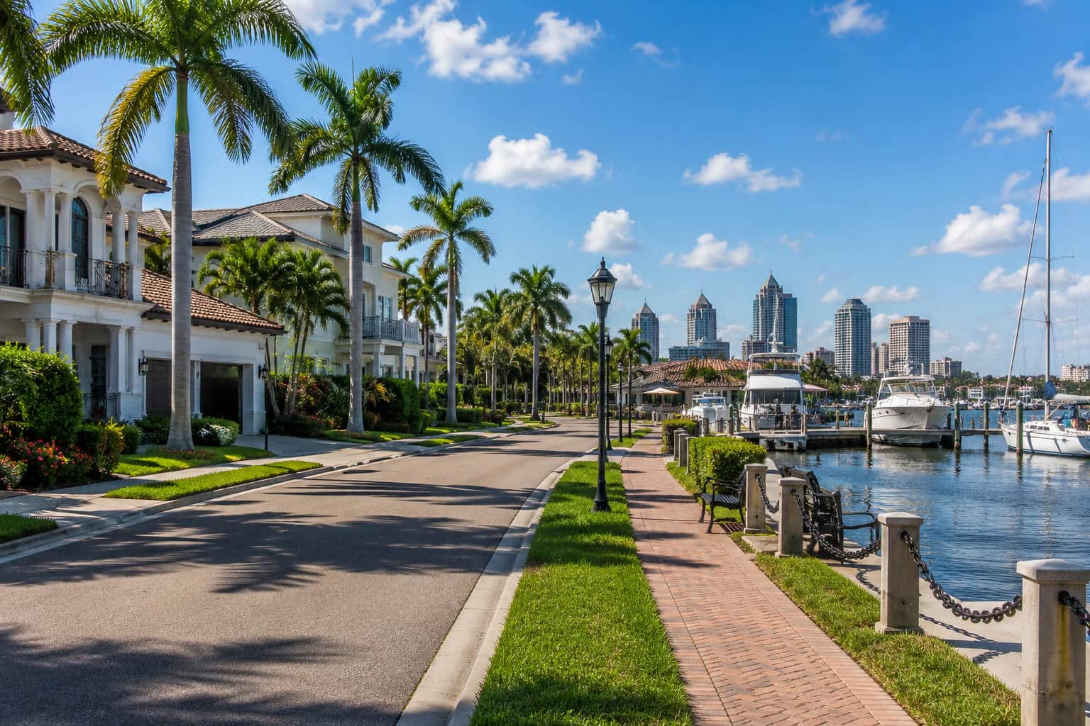 Waterfront street on Davis Islands with boats and the Tampa skyline