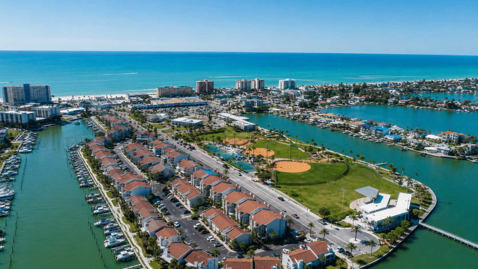 Canal homes and marina seen from the air at Madeira Beach