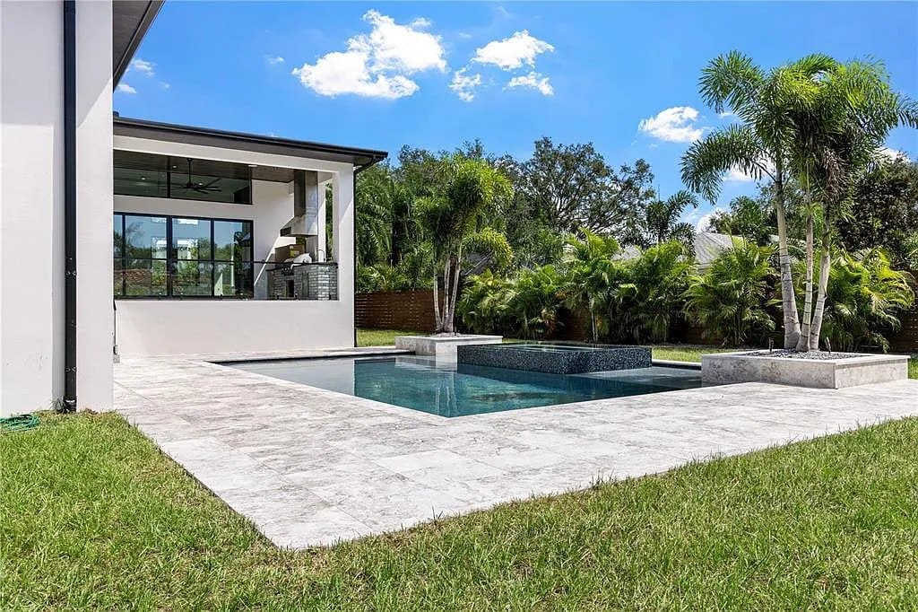 Pool and covered lanai designed for year-round outdoor living in Tampa Bay